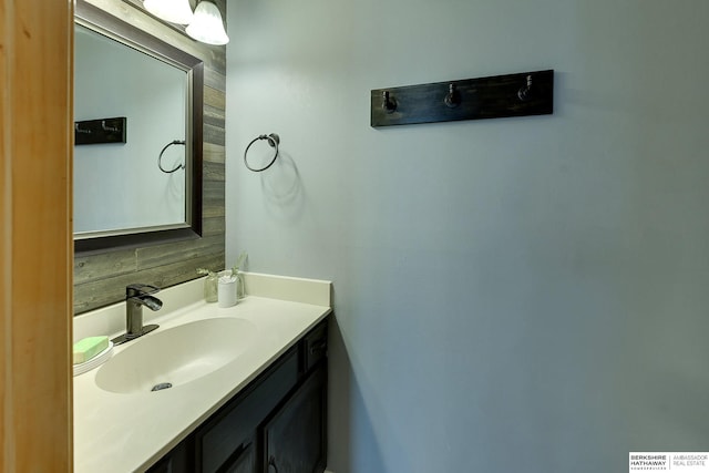 bathroom with vanity and decorative backsplash