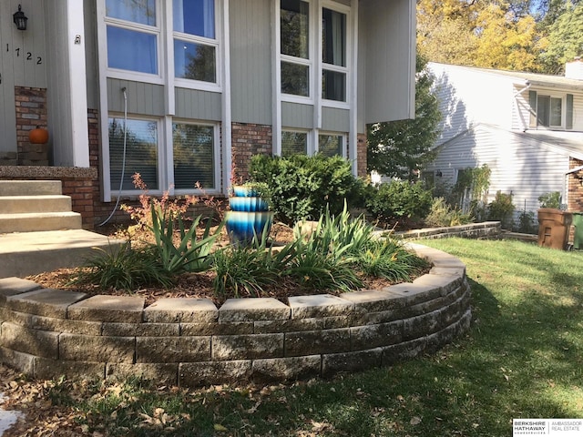 view of property exterior with a yard