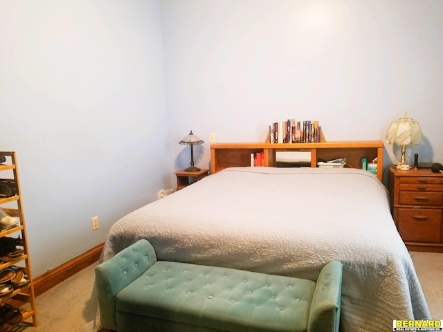 bedroom featuring light colored carpet