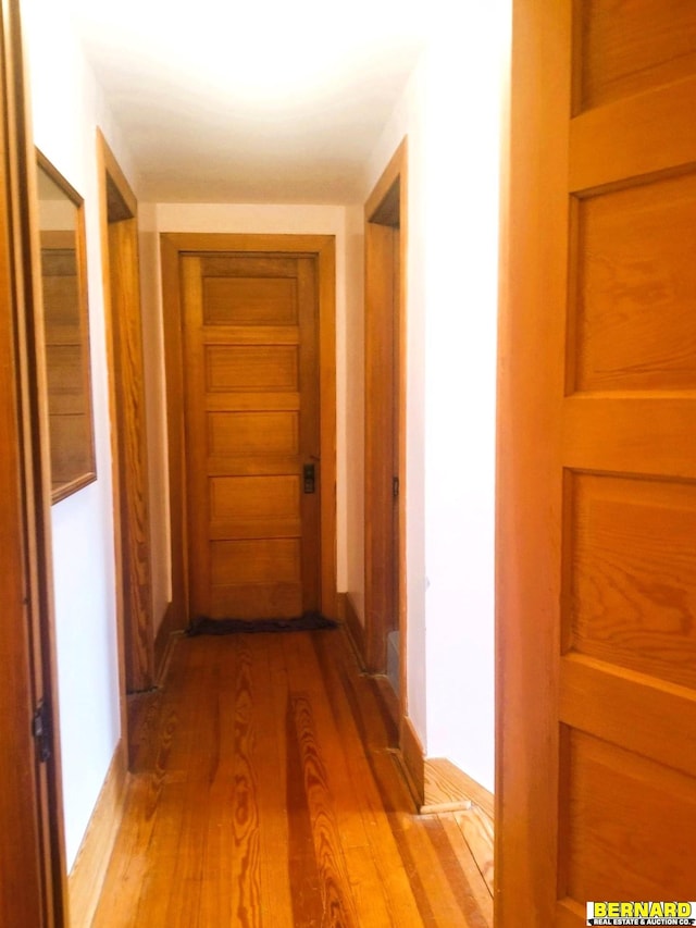 corridor with light wood-type flooring