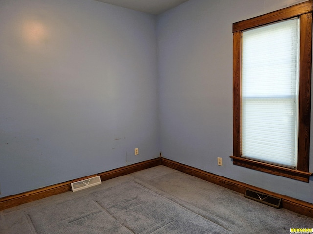 spare room featuring carpet floors