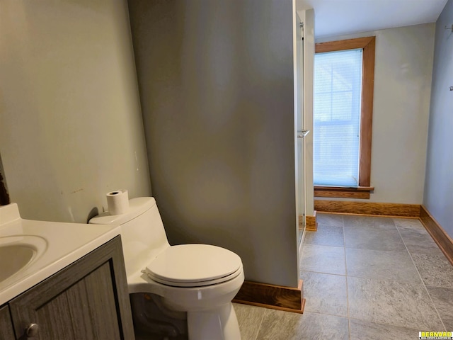 bathroom featuring vanity and toilet