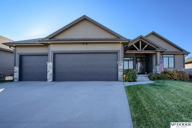 view of front of house with a garage and a front yard