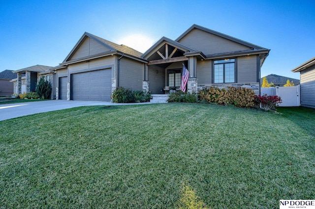 view of front of home featuring a front yard and a garage