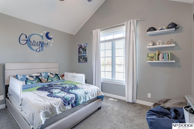 carpeted bedroom with vaulted ceiling