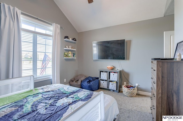 bedroom featuring vaulted ceiling, ceiling fan, light colored carpet, and multiple windows