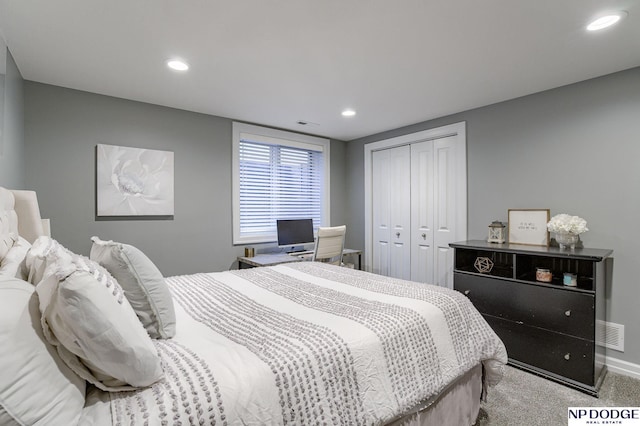 carpeted bedroom with a closet