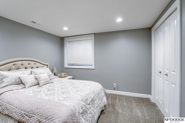 bedroom with a closet and carpet floors