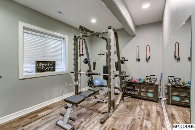 exercise area with hardwood / wood-style flooring