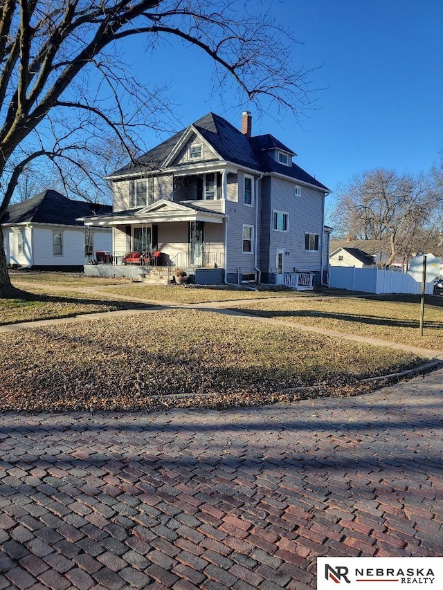 back of house with a porch