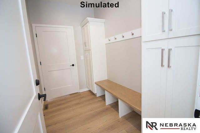 mudroom with light hardwood / wood-style flooring