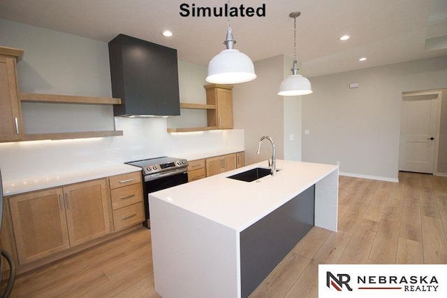 kitchen featuring stainless steel electric stove, extractor fan, decorative light fixtures, sink, and a center island with sink