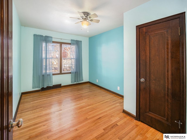 unfurnished room with ceiling fan and light hardwood / wood-style flooring