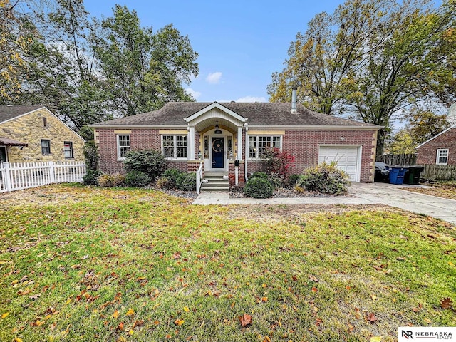 ranch-style home featuring a front lawn and a garage