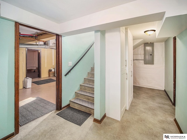 stairway with carpet floors and electric panel