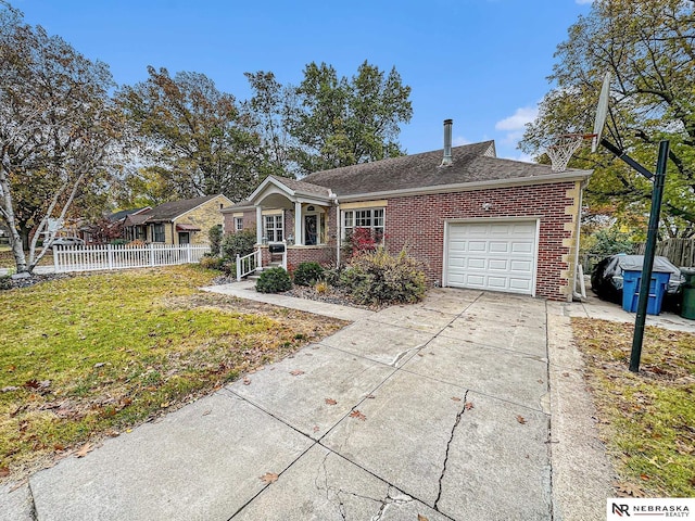 single story home featuring a garage and a front yard