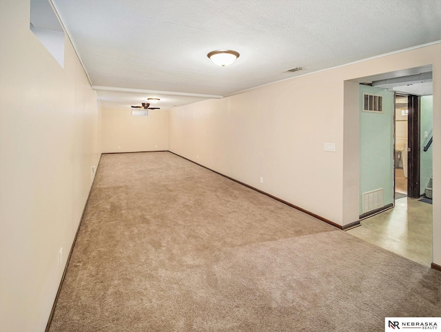 carpeted spare room featuring a textured ceiling