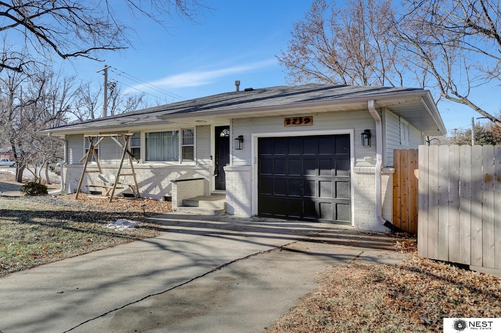 ranch-style home featuring a garage