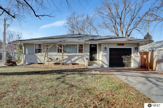 view of front facade with a front lawn and a garage