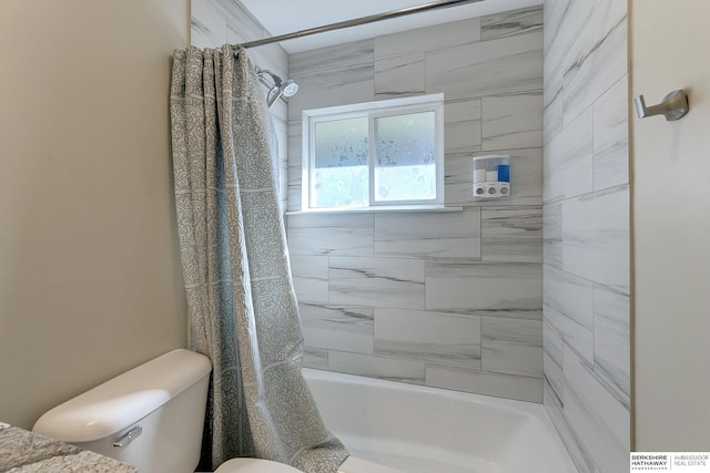 bathroom with toilet and shower / bath combination with curtain