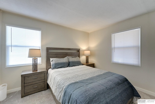 carpeted bedroom featuring ornamental molding