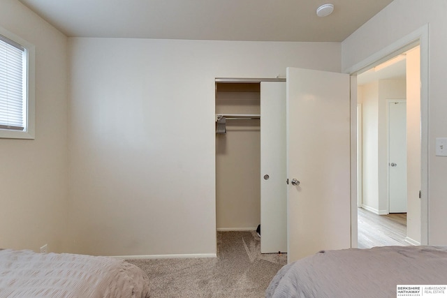 carpeted bedroom featuring a closet