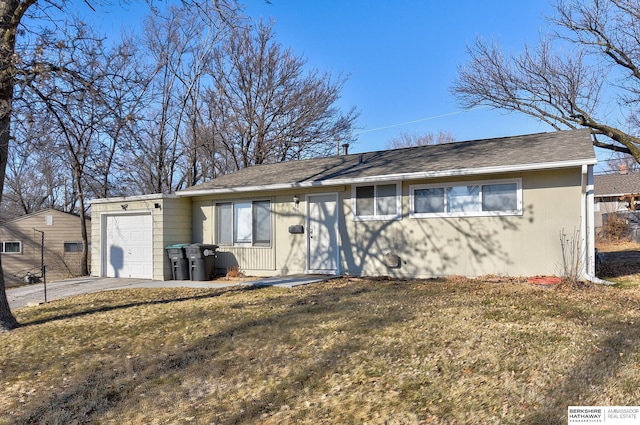 view of front facade with a garage and a front yard