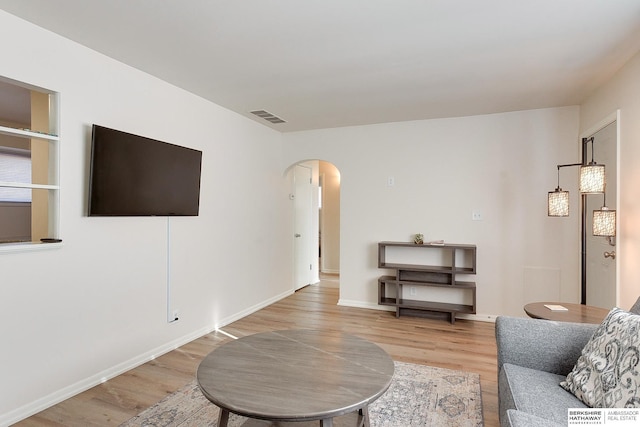 living room with light hardwood / wood-style flooring