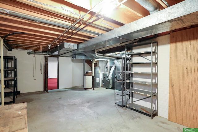 basement featuring electric water heater and heating unit