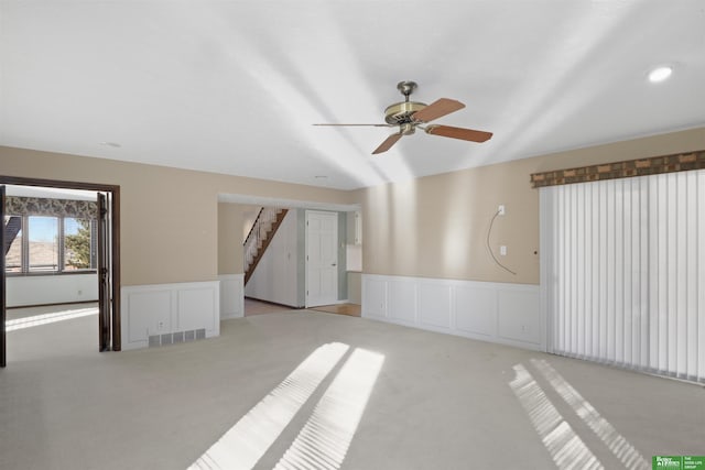 carpeted empty room with ceiling fan