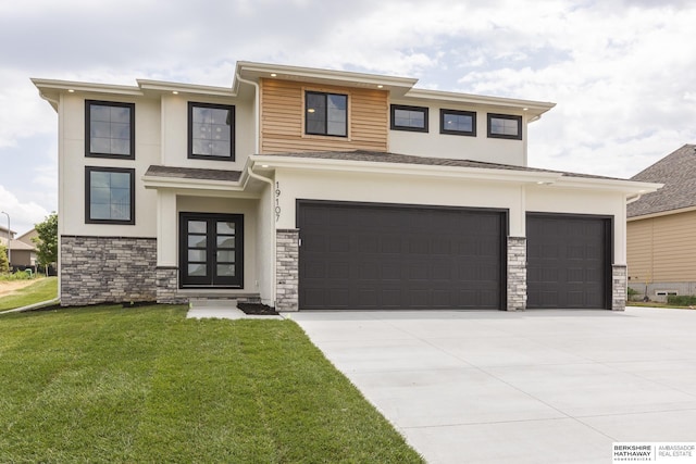 prairie-style home featuring a garage and a front yard