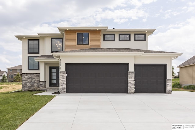 prairie-style house with a front lawn and a garage