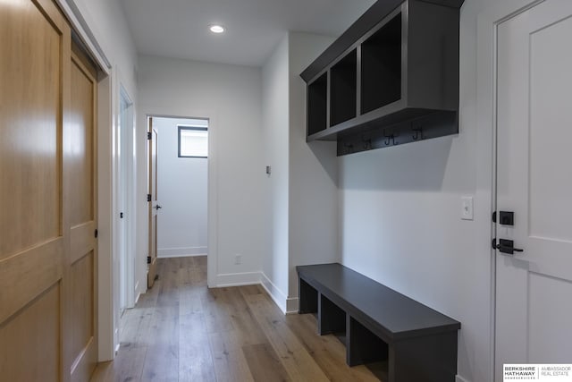 mudroom with light hardwood / wood-style floors