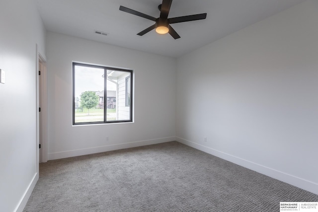 carpeted empty room featuring ceiling fan