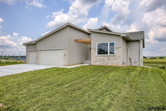 view of front facade with a garage and a front lawn