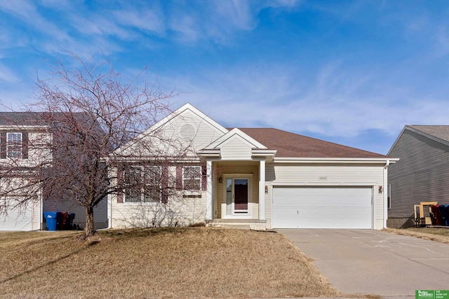 view of front facade featuring a front yard and a garage