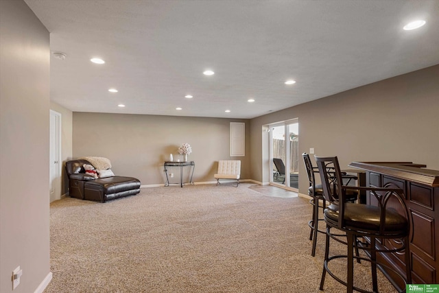 sitting room featuring light colored carpet