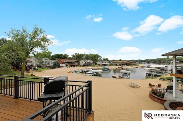 wooden deck with a water view