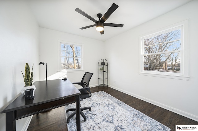 office area with ceiling fan and dark wood-type flooring