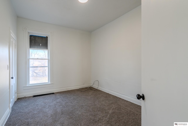 empty room with carpet flooring