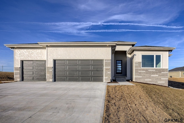 prairie-style home featuring a garage