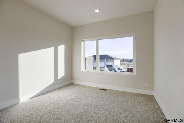 spare room featuring carpet flooring