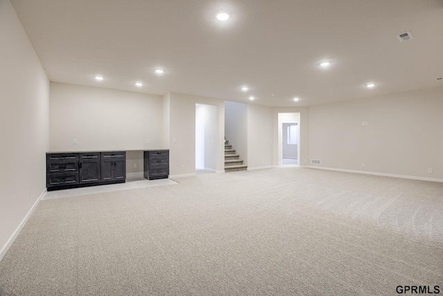 basement with light colored carpet