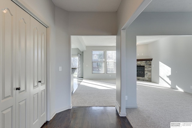 hallway with dark carpet