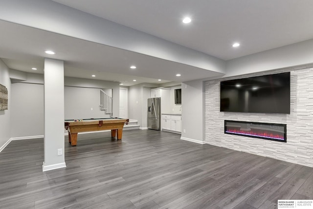 game room featuring wood-type flooring, pool table, and a fireplace