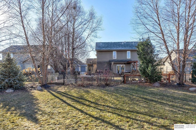 rear view of property with a lawn and a pergola