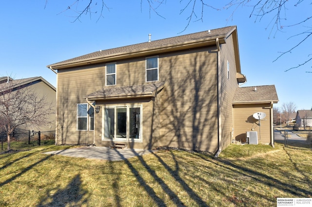 back of property featuring central AC, a lawn, and a patio