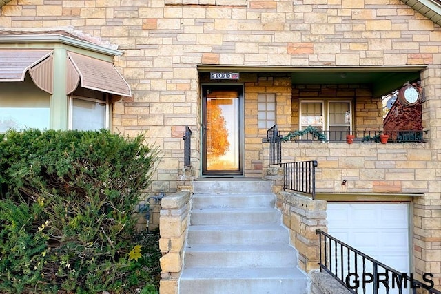 view of exterior entry with a garage