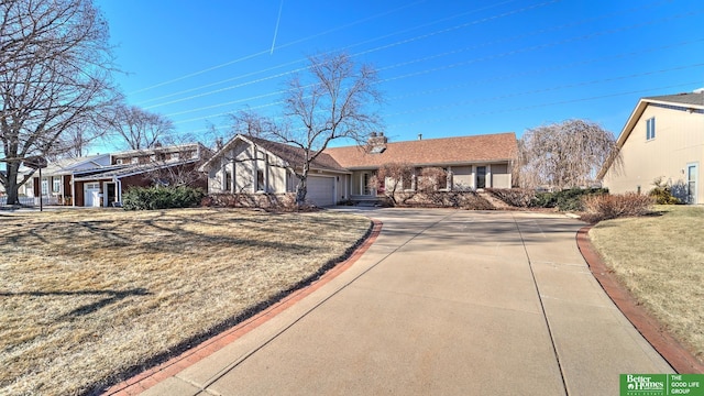 single story home featuring a garage and a front lawn