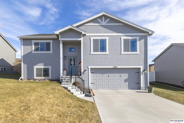 view of front of home with a front lawn and a garage